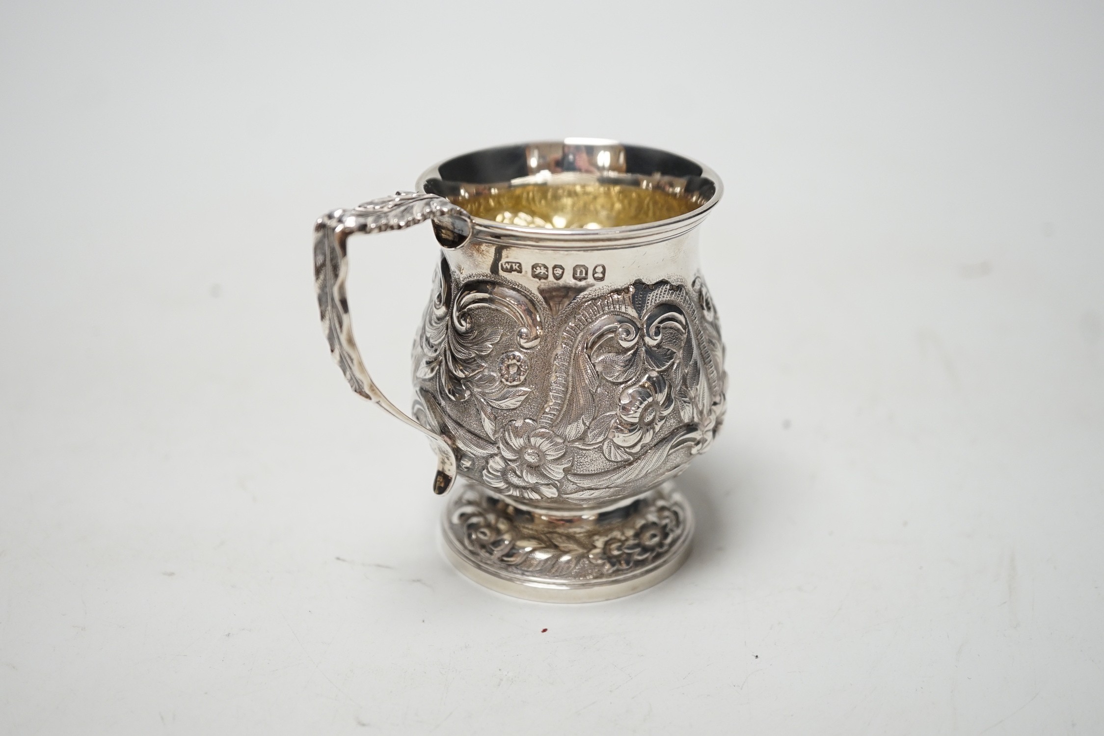A George IV embossed silver baluster christening cup, London, 1828, 82mm, 3.4oz.